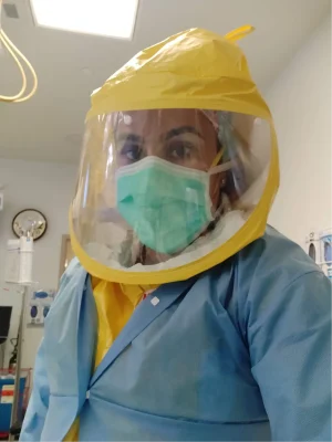 Dr Zeest Khan wearing a mask and protective hood.